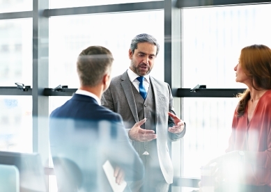 Business people discussing plans in modern office